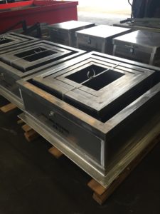 A group of metal boxes sitting on top of each other.